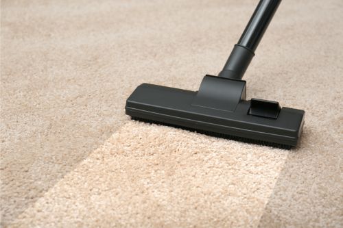 vacuuming carpet